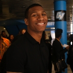 Black male graduate smiling